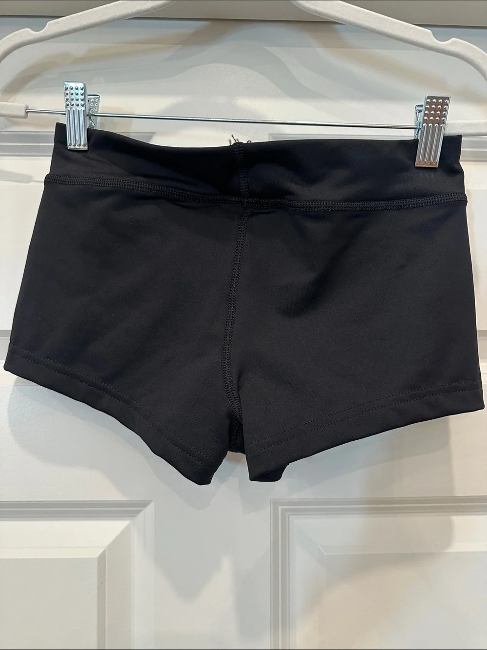 Nike Women's Black Athletic Shorts with White Swoosh Accent